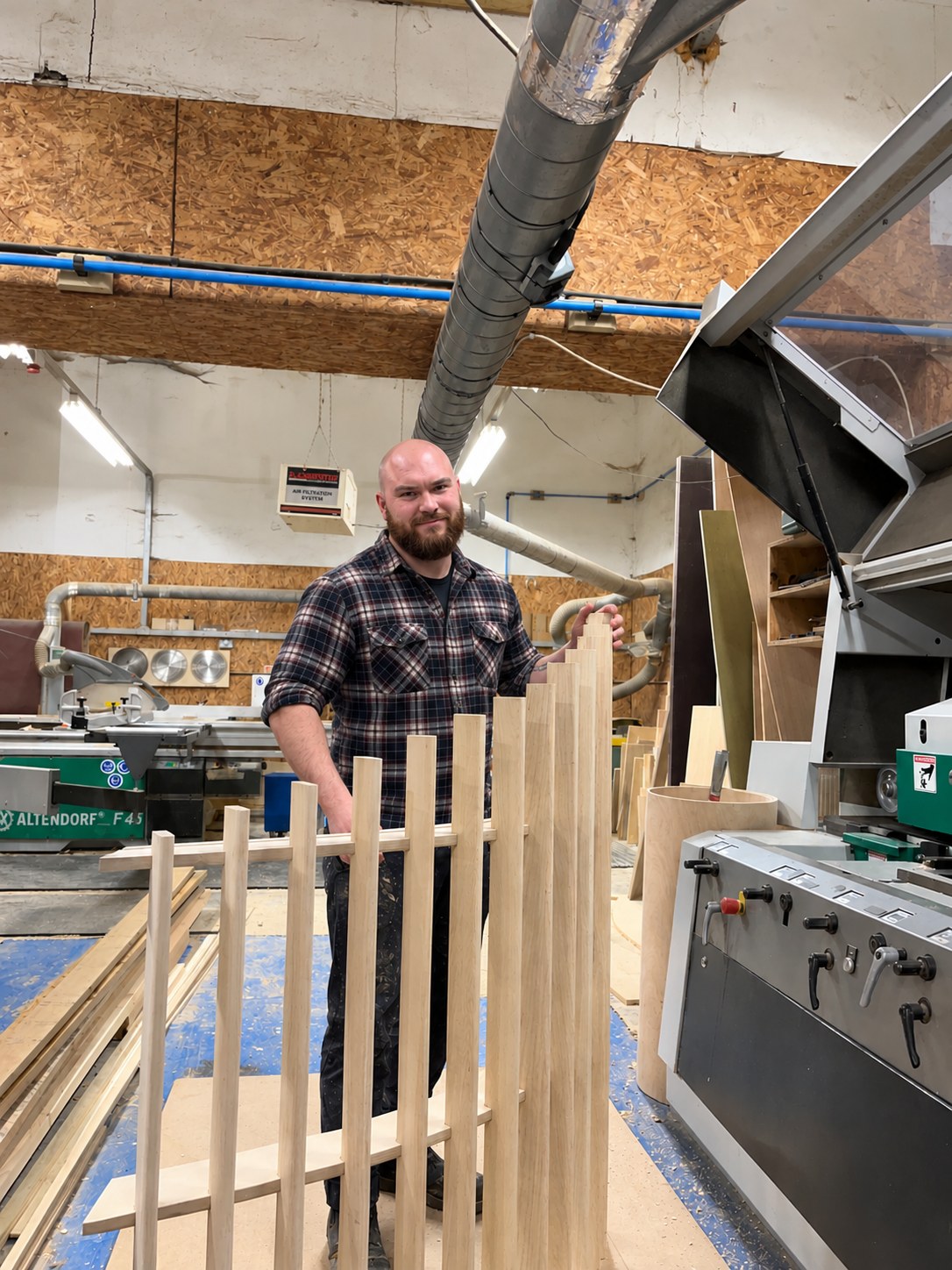 David Marsden in his workshop presenting a slatted ash screen
